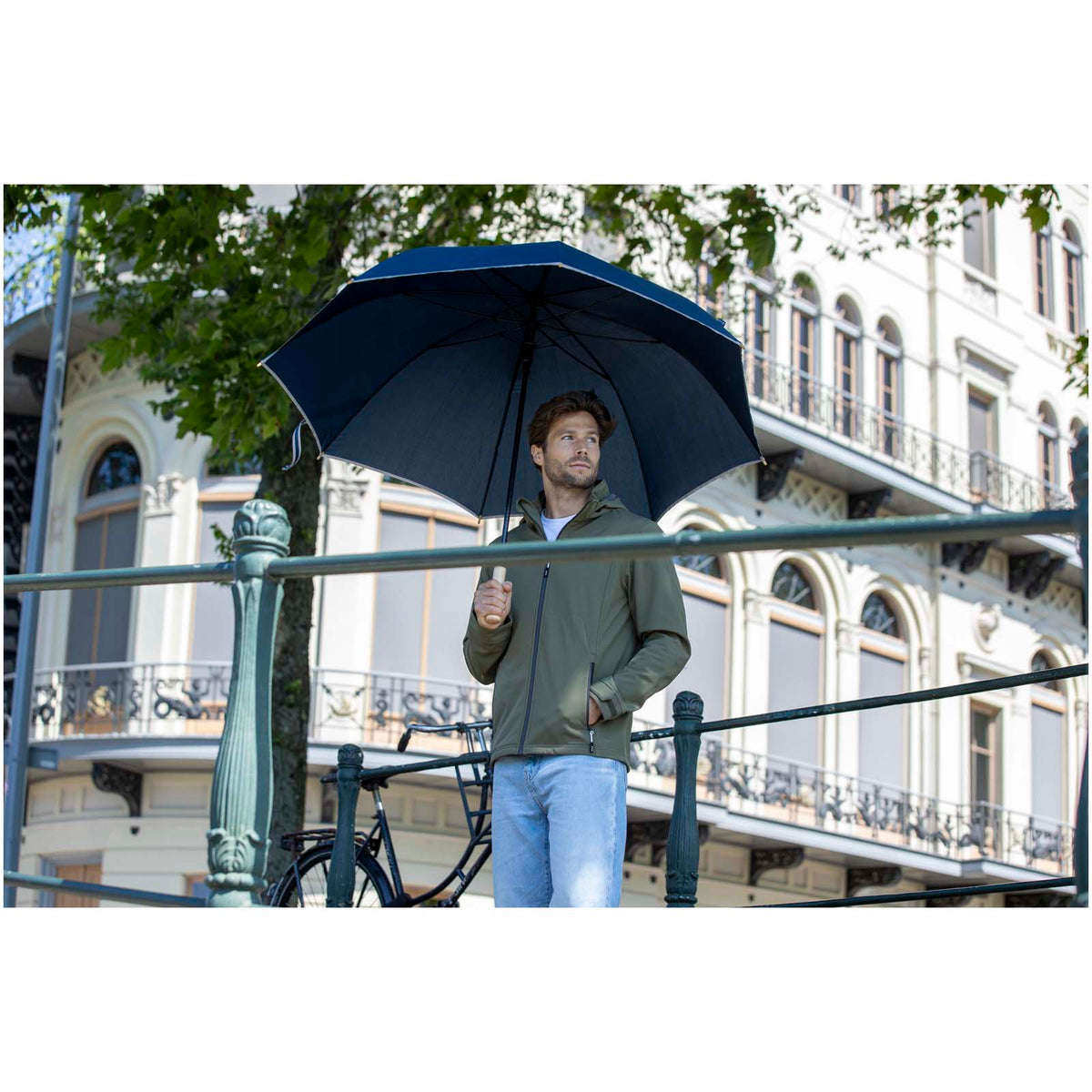 Branded Reflective Windproof RPET Umbrella 30 Inch Norman Navy umbrella in use outdoors
